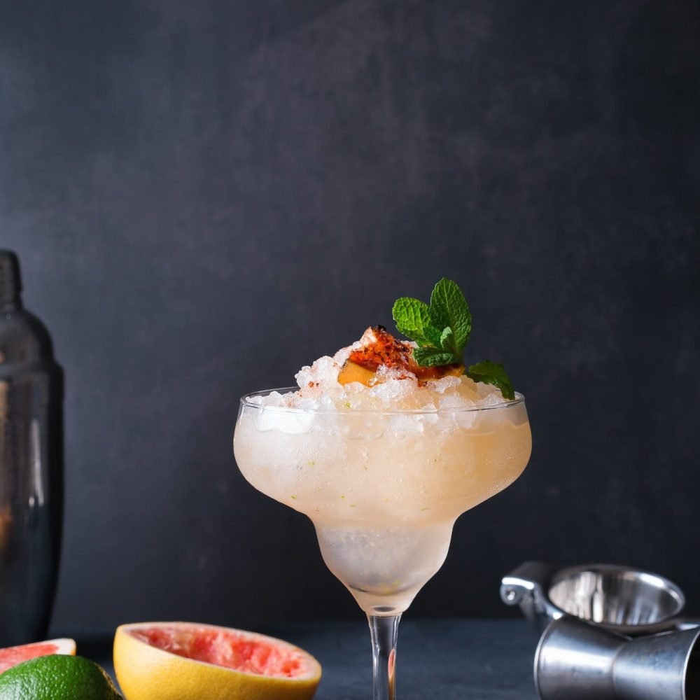 Frozen Mezcal or mescal Paloma cocktail with grilled grapefruit